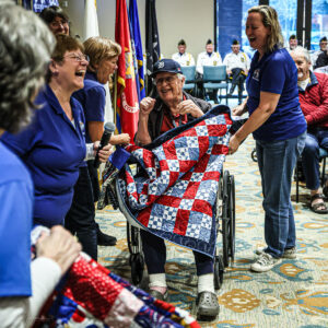  Bee Sew Brave presents WWII Veteran with an honor quilt
