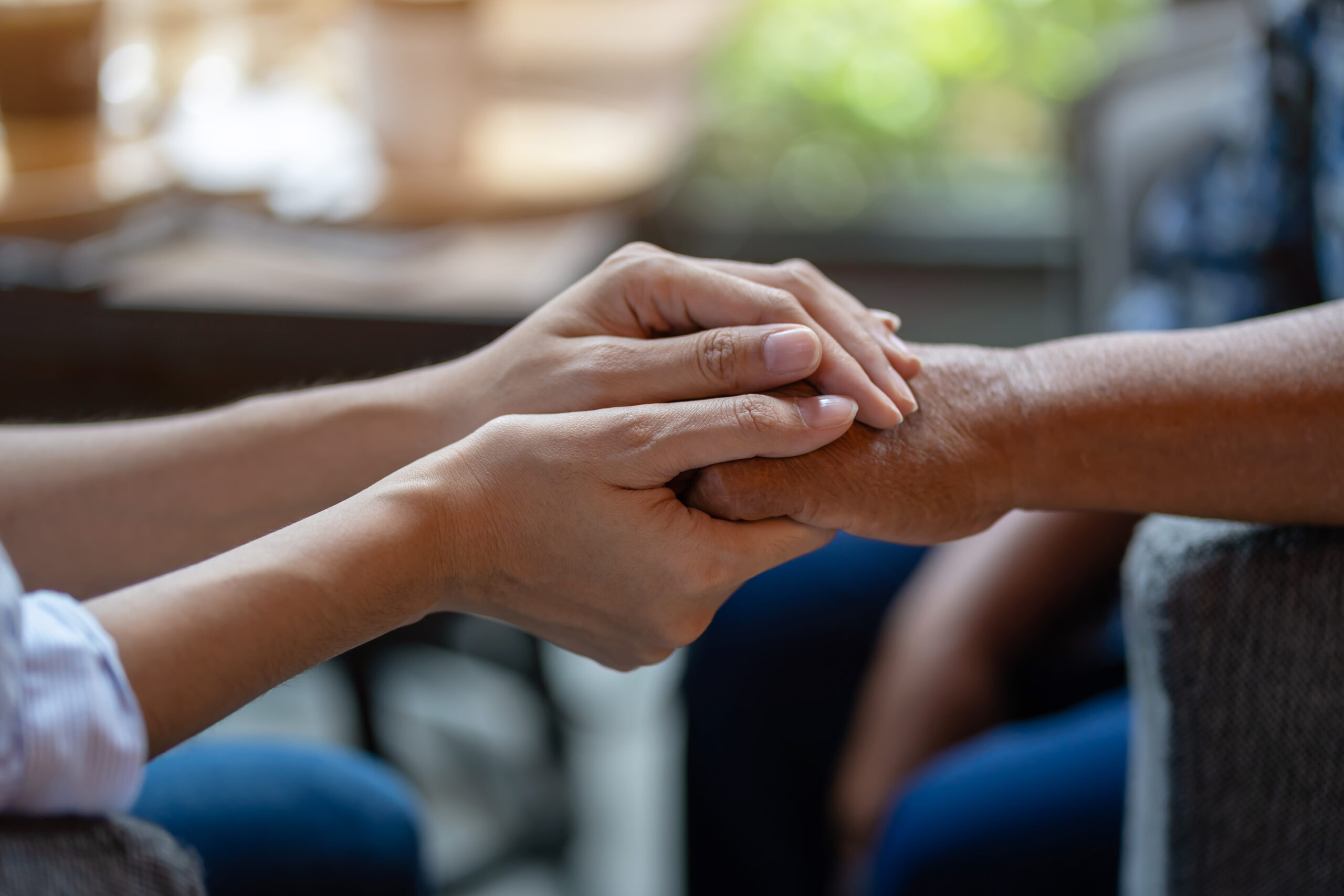 Caregiver and older adult smiling