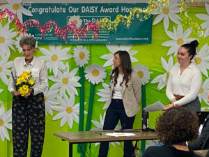 Hailey Wolfe being presented the Daisy Award