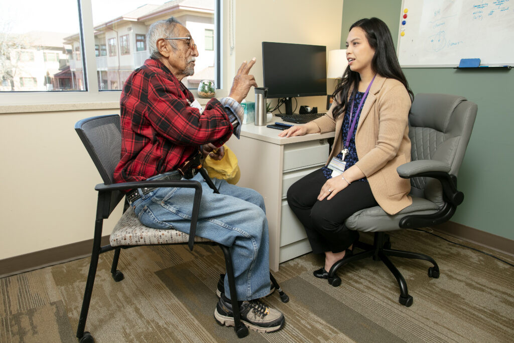 Older adult receiving supportive care and assistance to stay active and independent in the community