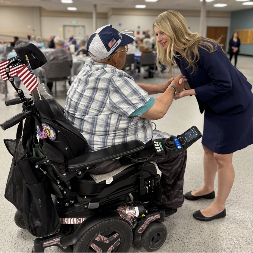Rep. Brittany Petersen greets a Veteran