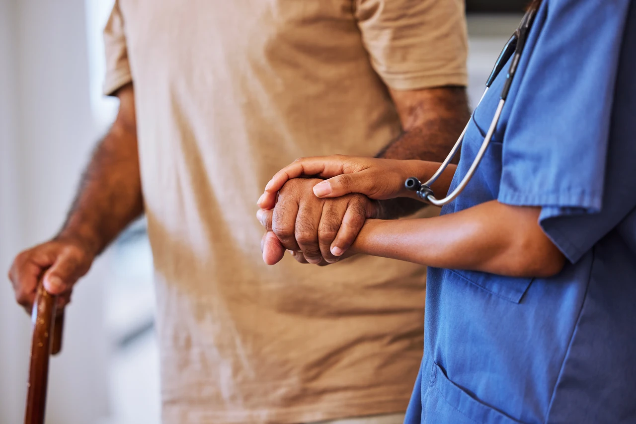 Diverse group of healthcare professionals, volunteers, and community members collaborating in an inclusive care environment